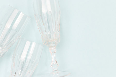 Crystal glasses on a blue background. Minimal composition with copy space.の写真素材