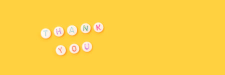 Thank you. Banner with quote made of beads with letters on a yellow background.の写真素材