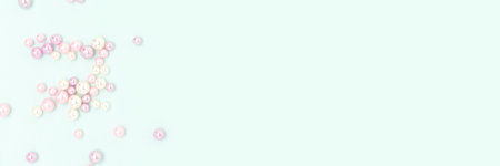 Banner with imitation pearl beads scattered on a blue background. Creative concept with copy space.の写真素材