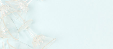 Banner with crystal glasses on a blue background. Place for text.の写真素材