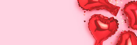 Banner with red foil balloons in a heart shape and confetti. Creative concept on a pink background.の写真素材
