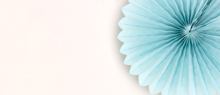 Banner with one blue tissue paper fan on a gray background.の写真素材