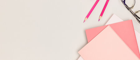 Banner with pink school supplies on a gray background. Place for text.の写真素材