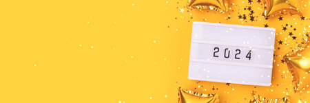 Banner with 2024 numbers on a yellow background. Golden stars confetti, lightbox and inflatable...