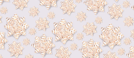 Banner with pattern made of shiny gold colored ribbon bows on a blue background.