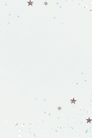 Silver stars and crystals confetti scattered on a blue background. Festive concept with copy space.の写真素材