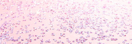 Banner with silver crystal confetti on a pink background. Selective focus.の写真素材