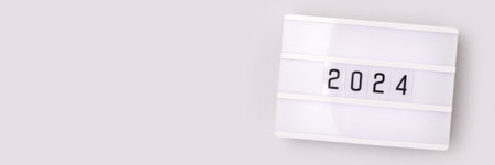 Banner with 2024 numbers on a gray background. New Year minimal composition.