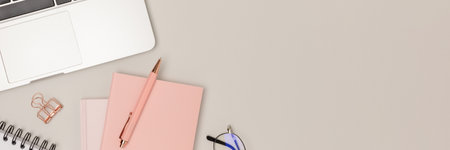 Banner with office supplies and laptop on a gray background. Business workspace with place for text.