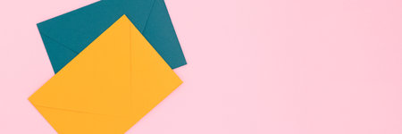 Banner with multicolored envelopes on a pink background. Concept with copy space.