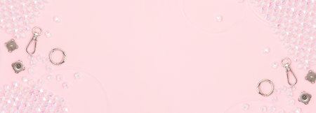 Banner with equipment and findings for handmade beaded bag on a pink background.