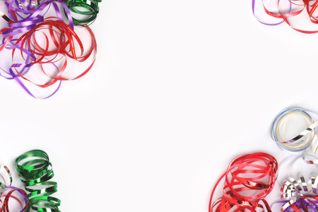 Frame made of ribbons on a blue background. Festive concept with copy space.の写真素材