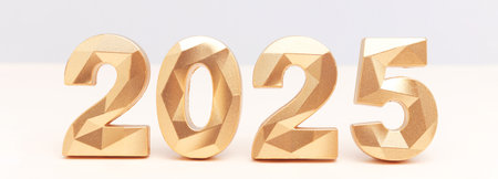 2025 - golden numbers in front of blue background. Banner with New Year concept.