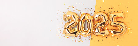 Banner with 2025 New Year festive concept. Golden numbers air balloons and shiny stars confetti on a blue background.の写真素材
