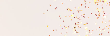 Banner with golden stars confetti on a gray background.