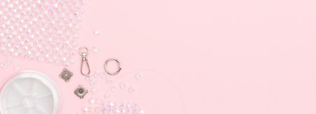 Details, equipment and findings for beaded bag on a pink background. Banner with copy space.