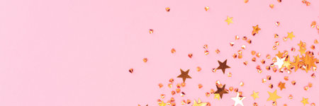 Banner with golden stars and crystals confetti on a pink background.