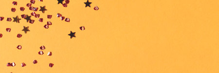 Banner with golden stars and crystals confetti on a yellow background.の写真素材