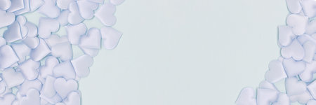 Banner with frame made of textile hearts confetti on a blue background.