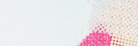 Banner with details for handcraft bag made from acrylic beads on a blue background.の写真素材