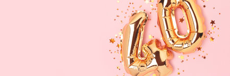 Banner with number fourty golden balloons and stars confetti on a pink background. Place for text.の写真素材