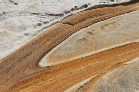 Sandstone rock formation by the oceanの写真素材