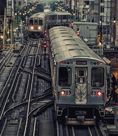 Train on elevated tracks within buildings at the Loop, Chicago City Center - Dark Cross Processing...