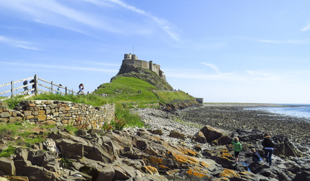 Lindisfarne Castle panoramic view, with blue sky in a summer day, Holy Island, Northumberland, UKのeditorial素材