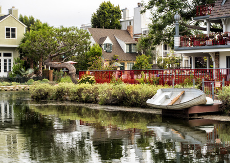 Venice Canals, cosy colorful house with boat on the 13th August, 2017 - Venice Beach, Los Angeles, California, USAのeditorial素材