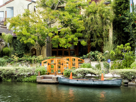 Venice Canals, cosy colorful house with boat on the 13th August, 2017 - Venice Beach, Los Angeles, California, USAのeditorial素材