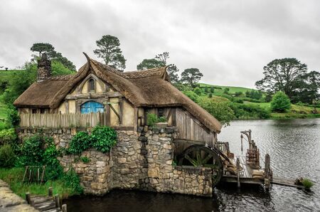 1st of December, 2018: Hobbit Moulin and bridge at Hobbiton Movie Set - Matamata, South Island, New Zealandのeditorial素材
