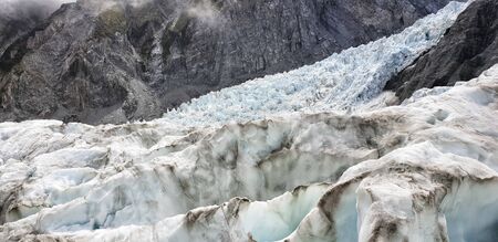 Franz Josef Glacier crampons hike through the blue glacier ice - New Zealand, South Island, NZ