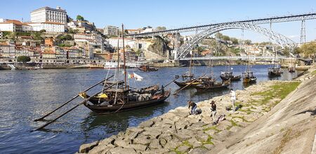 March 29, 2019: Porto cityscape with buildings and boats close to the Luis I Bridge - Portugalのeditorial素材