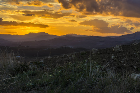 The beautiful colors of a sunset in the central Sicily.の写真素材