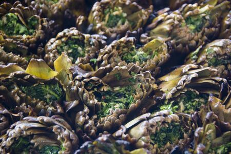 Artichokes cooked on the grill complete with parsley and garlicの写真素材
