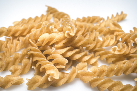 wholewheat pasta propeller on a white backgroundの写真素材