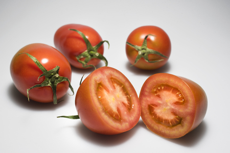 Tomatoes on light grey backgroundの写真素材