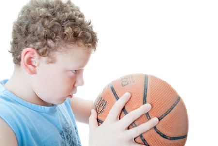 boy with a basketball on a white backgroundの写真素材