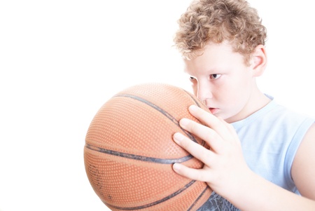 boy with a basketball on a white backgroundの写真素材