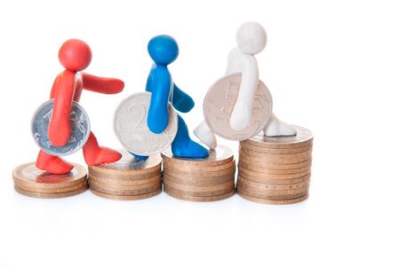 multicolored plasticine figures are coins on the steps upの写真素材