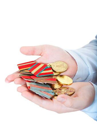 Medals in the children s hands on a white backgroundの写真素材