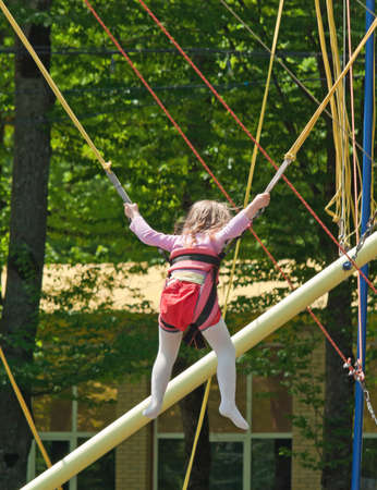 Girl jumping on a trampoline