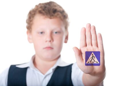 Boy shows shows the sign  pedestrian crossing の写真素材