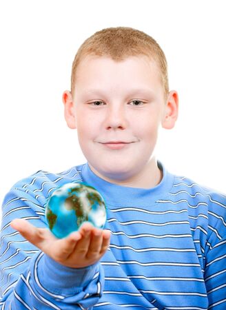 Boy holding a globe in the form of the planetの写真素材