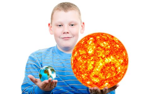 Boy holding the sun and the terrestrial globe の写真素材