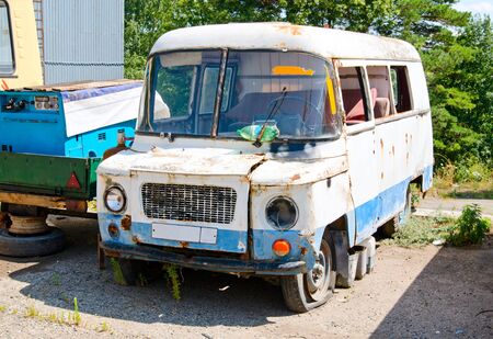 rusty old van in the parking lotの写真素材