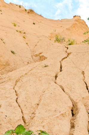 a large crack in the sandstone rocksの写真素材