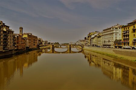 Florence city Italy bridge on Arno river in sunsetの写真素材