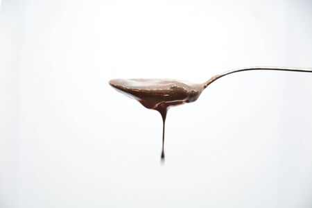 chocolate spoon on white backgroundの写真素材