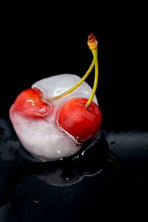 red cherries in ice cubeの写真素材